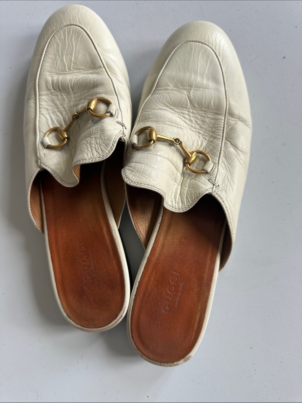 J1–Gucci Ivory Leather Horsebit Backless Mules with Gold Hardware